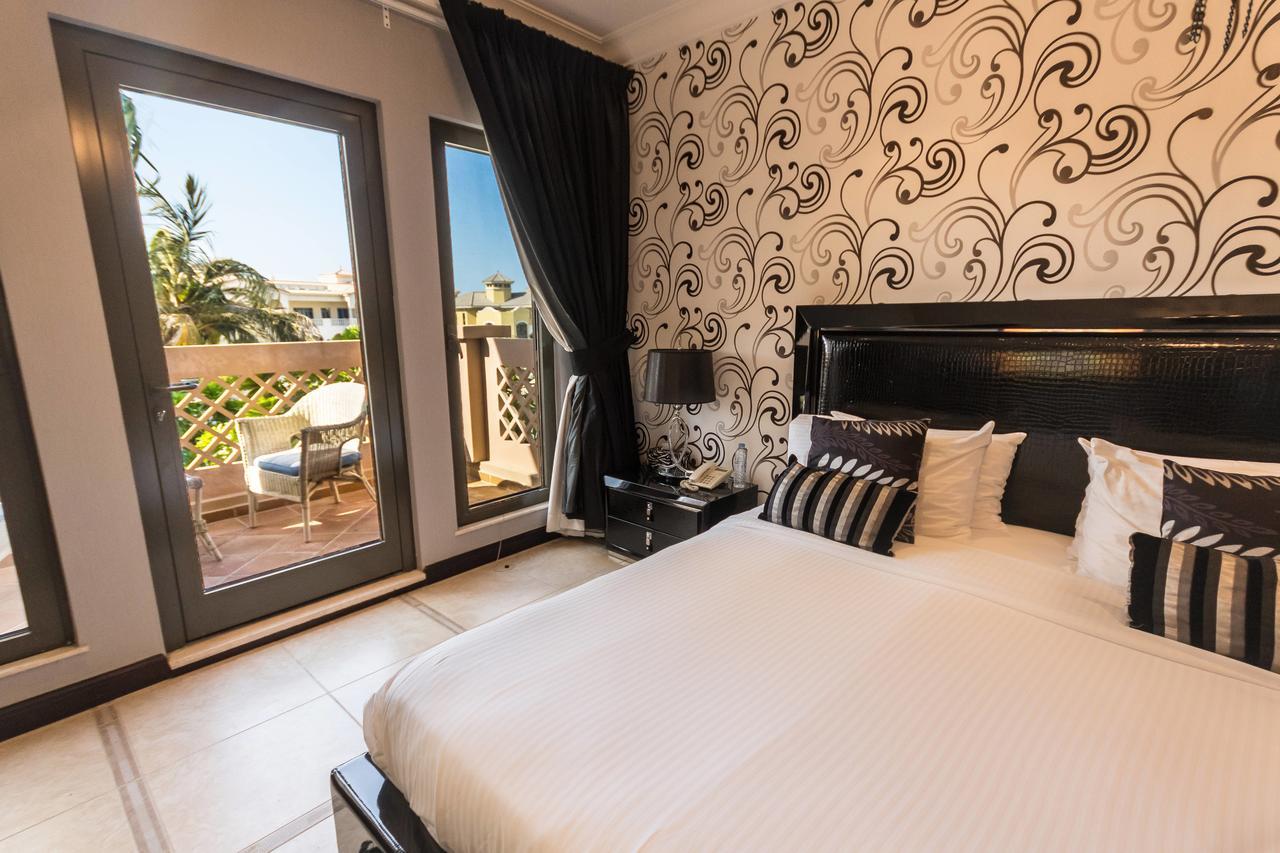 Yanjoon Holiday Homes - Palm Jumeirah Frond A Villas Dubai Bagian luar foto